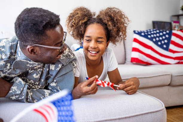 istock Military dad hugs preschool age daughter 2149660439