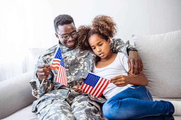 istock Military dad hugs preschool age daughter 2149660440