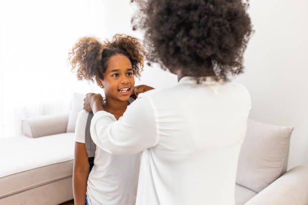 istock Mother preparing her child for school 2149660556
