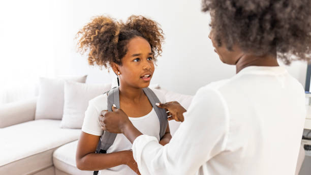 istock Mother preparing her child for school 2149660606