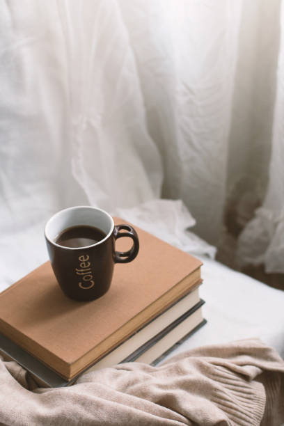 istock Simple composition of indoor relaxation with coffee and books. 2149662218