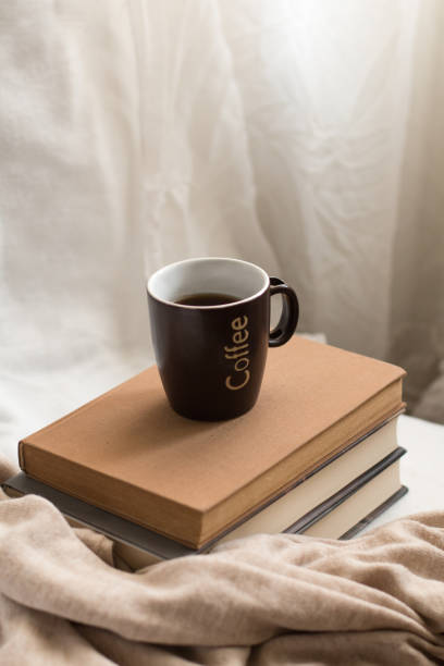 istock Simple composition of indoor relaxation with coffee and books. 2149662326