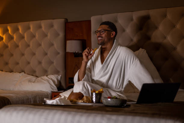 Enjoying Room Service with Some Television