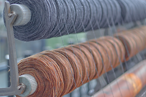 brown and black spools of thread as background