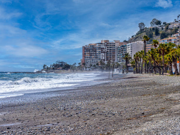 istock Sandy Beach With Palm Trees and Buildings 2149668215