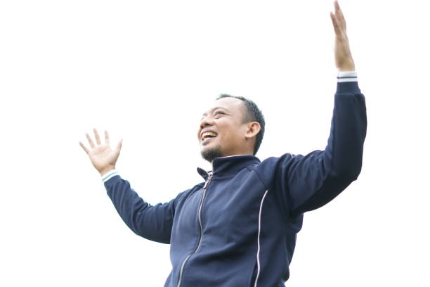 Asian male model wearing blue sportswear with an enthusiastic expression of being in nature