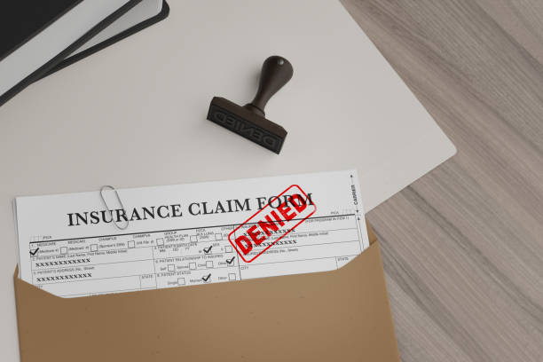 istock Document with denied stamp and a stamper  put on the  wooden table 2149670030