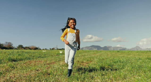 Child, running or girl on chicken farm in agriculture, farming or agro environment freedom. Smile, happy or Mexico kid with energy, poultry and animal birds for nature fun, games and playing in field