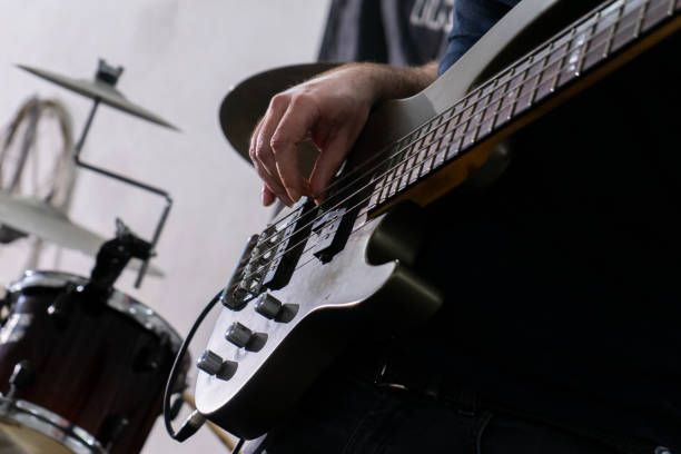 istock A man playing a bass guitar. 2149672030