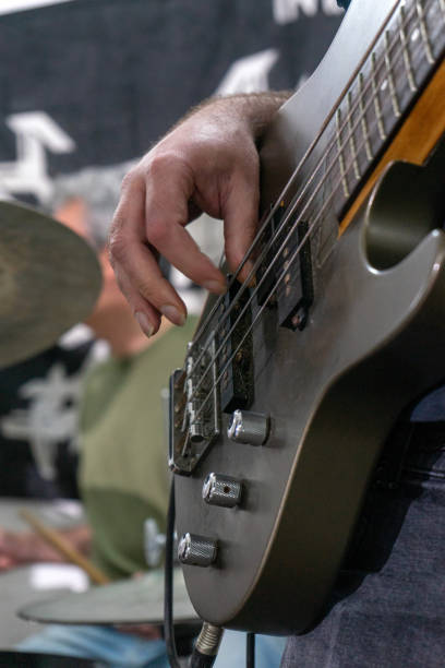 istock A man playing a bass guitar. 2149672031