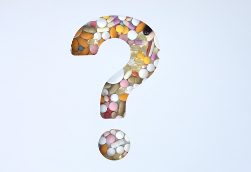 Question Mark with pills.