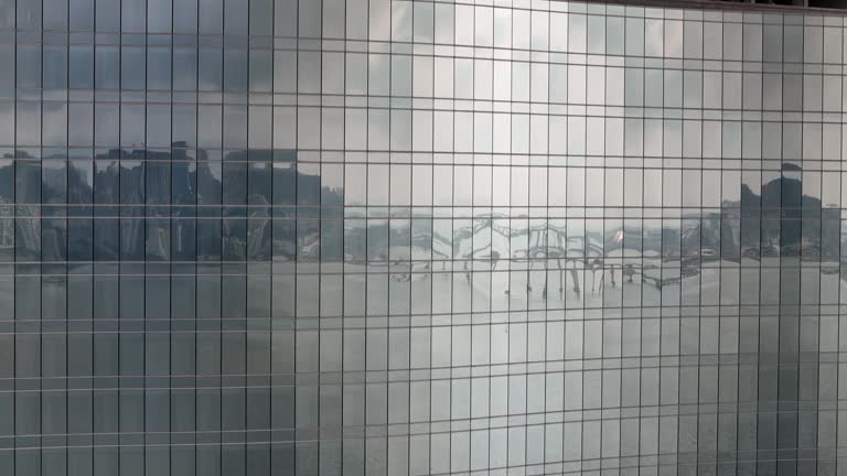 The reflection of the glass on the exterior wall of a skyscraper