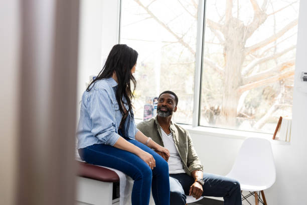 istock Husband looks up at his wife while she tells him about her day 2149681105