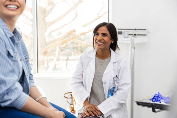 istock Unrecognizable female patient looks at her unseen husband while talking with the doctor 2149681139