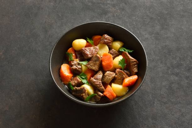 istock Beef stew with potatoes, carrots and greens 2149681172