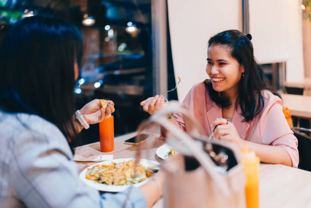 istock Women eating  together in cafe 2149681324