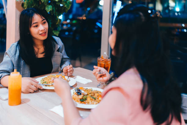 istock Women eating  together in cafe 2149681326