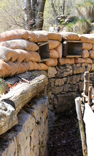 Two slits with sandbags for protection from enemy attacks in a trench dug in the ground