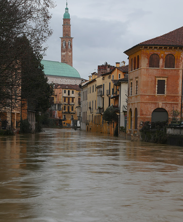 Vicenza, VI, Italy - February 28, 2024: 
Bachiglione River and Monument called BASILICA PALLADIANA during flood