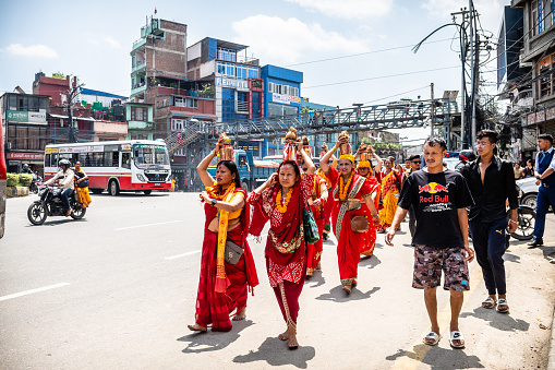 kathmandu, nepal. 25th august, 2023: devotees walking at kathmandu street, nepal