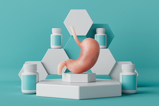 Human Stomach Anatomy Internal Organ and Medical Jars with Pills or Vitamins on a Podium on a blue background. 3d Rendering