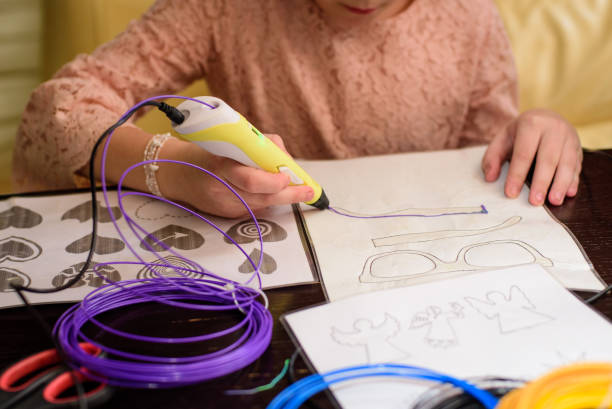 istock Children draw by 3d printing pen, working by melting ABS plastic 2149683188