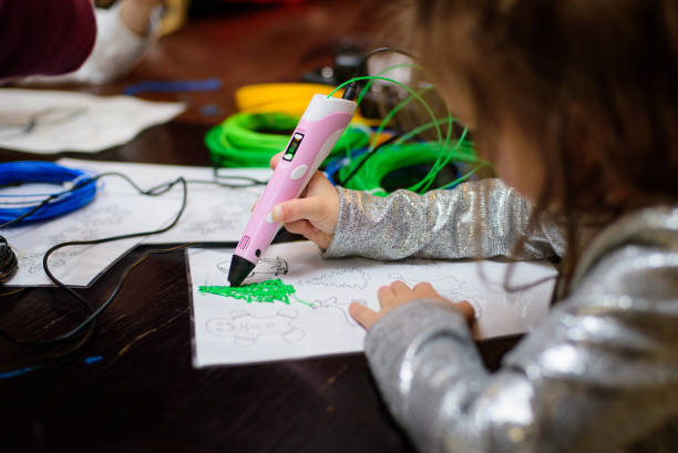 istock Children draw by 3d printing pen, working by melting ABS plastic 2149683523