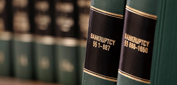 Bankruptcy law books on shelf bookshelf for legal reference