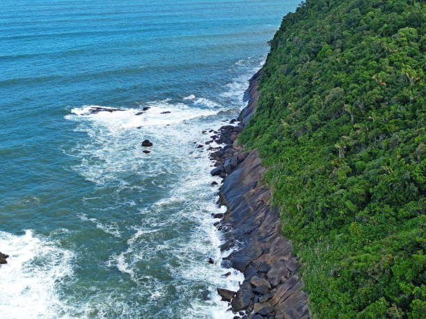 istock White waves breaking on rocks on island coast 2149685369