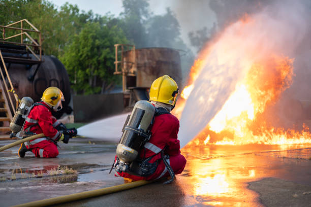 istock Firefighters Extinguishing Blaze in Industrial Area 2149685636
