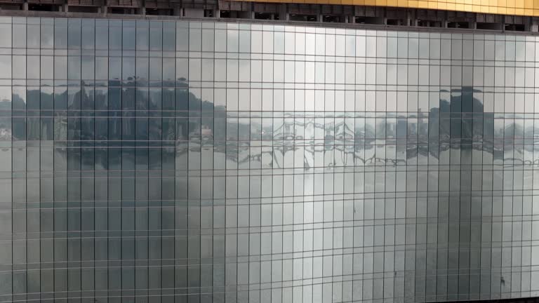 The reflection of the glass on the exterior wall of a skyscraper