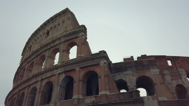 Cinemaatic view of facade of ancient arena Colosseum a landmark of Rome, Italy