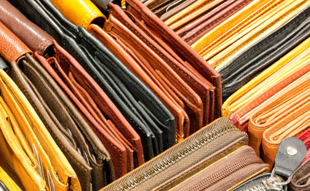 Many leather wallets created by hand by skilled craftsman for sale in the leather goods shop