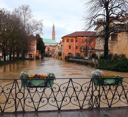 Bridge and river called FIUME RETRONE in Vicenza City in northern Italy during flood and monument