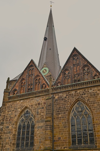 Spire, clock and front elevation of a Roman Catholic church - Saints Peter and Paul - in Williamsville, NY.