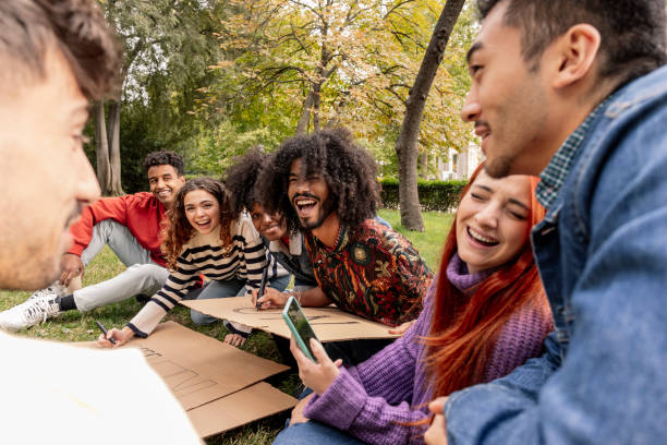 istock Friends Laughing Together While Creating a Peaceful Message in the Park 2149687872