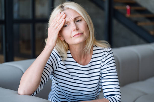 istock Upset middle aged woman feeling bad and has headache 2149688037