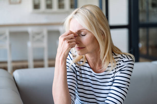 istock Middle aged woman with headache feeling tired and stress 2149688041