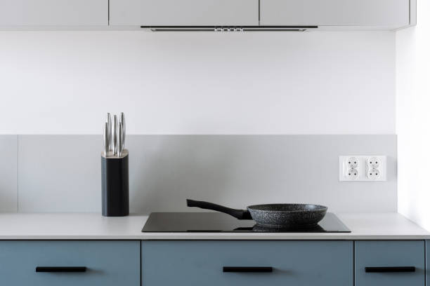 istock Glass ceramic electrical hob with frying pan on kitchen with minimalist style 2149688080