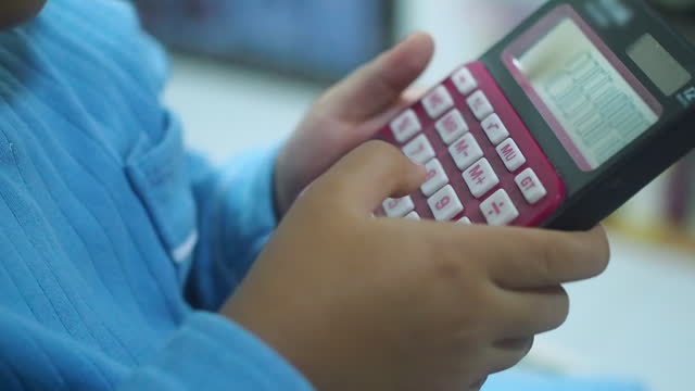 Hand Baby Girl Using Calculator