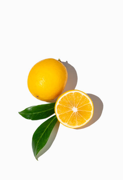 istock Fresh cut lemons on isolated white background with shadow and leaves. 2149689643