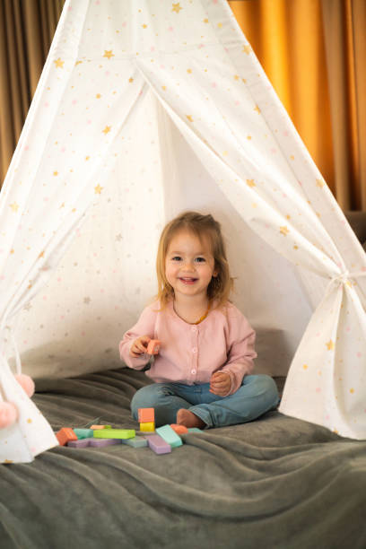 istock Girl playing whit toys in her tent 2149689647