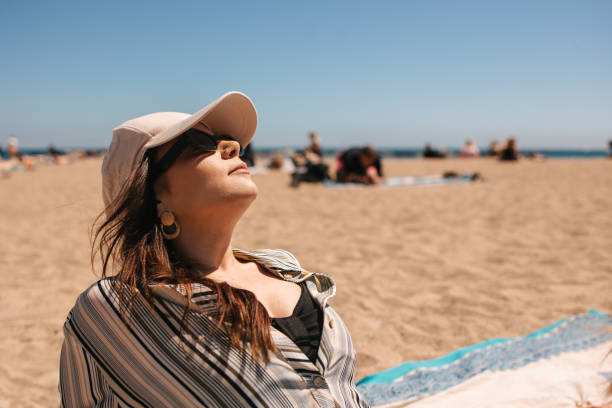 istock Woman lying on the beach 2149691512
