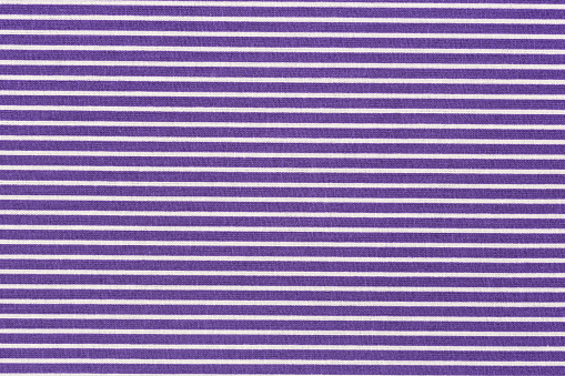 Close up of violet striped fabric texture useful as a background - high resolution.