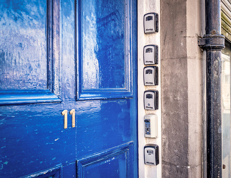 Edinburgh, Scotland - A series of security boxes for keys outside the entrance door to flats, used for Airbnb and other short term rentals.