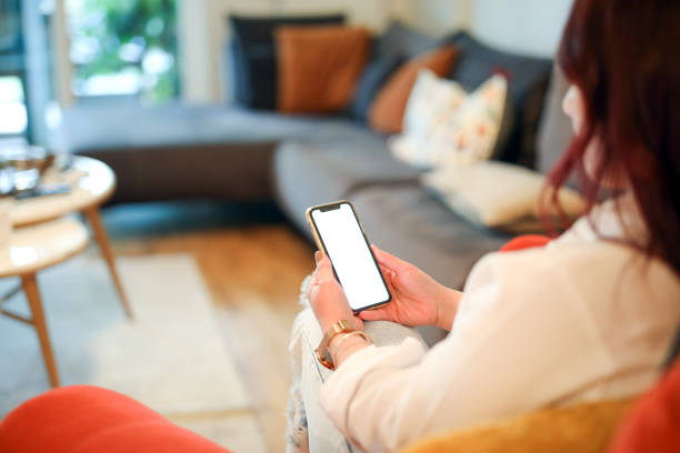 istock Woman Looking at Blank White Phone Screen at Home, Home Lifestyle, Wireless Technology, Device Screen 2149696871