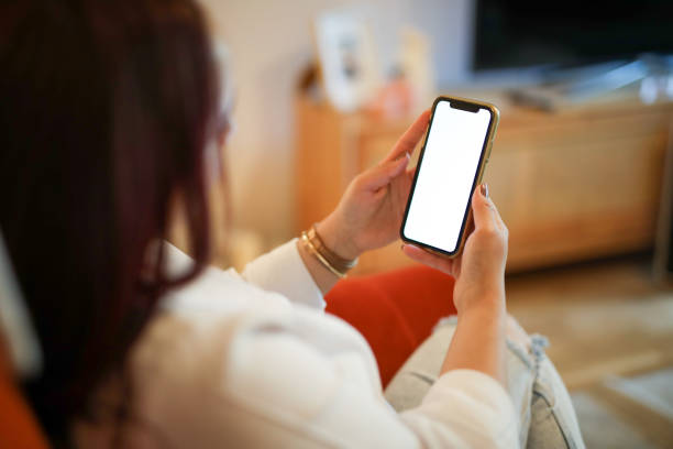 istock Woman Looking at Blank White Phone Screen at Home, Home Lifestyle, Wireless Technology, Device Screen 2149696894