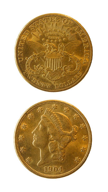 istock A real gold 20-dollar American coin. Reverse, head, Liberty, and obverse with an eagle. 1904. Every detail of the coin is visible. Top view. 2149698054