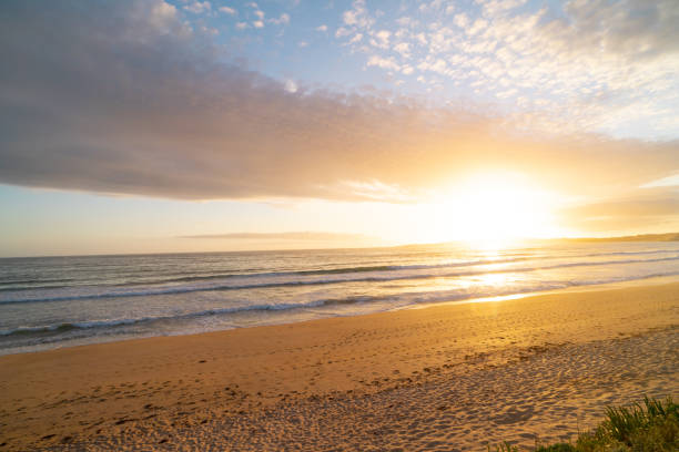istock The beach is empty and the sky is a beautiful orange color 2149699522
