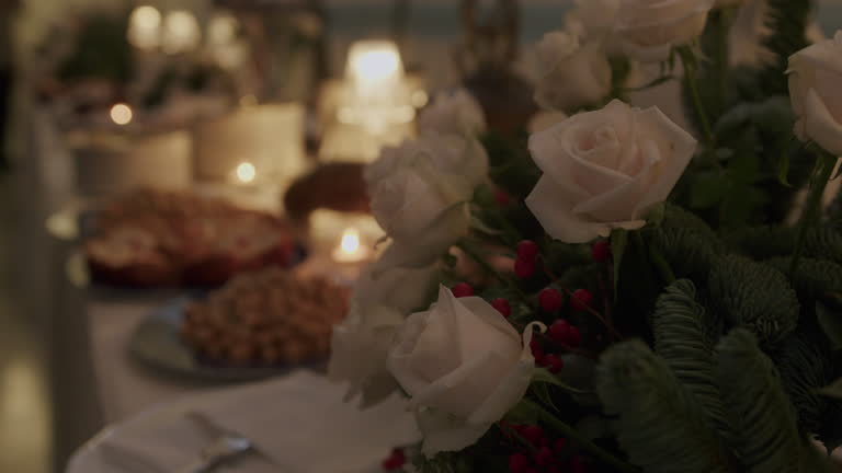 Table full of sweets and flowers in an italian wedding party